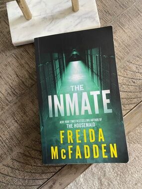The Inmate by Freida McFadden - Green & Yellow Paperback Thriller